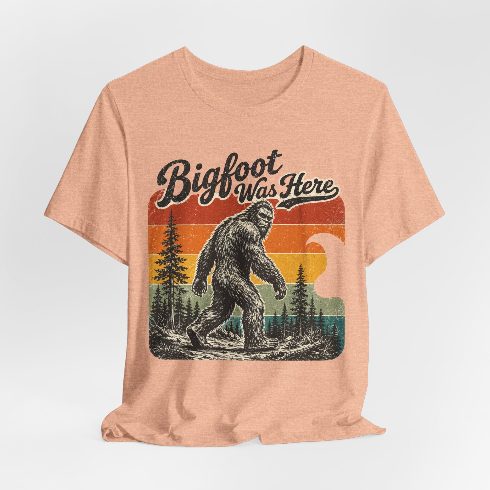 Bigfoot Was Here Tee in Pink - vintage Bigfoot striding forest golden hour humor shirt, Barely Outdoorsy