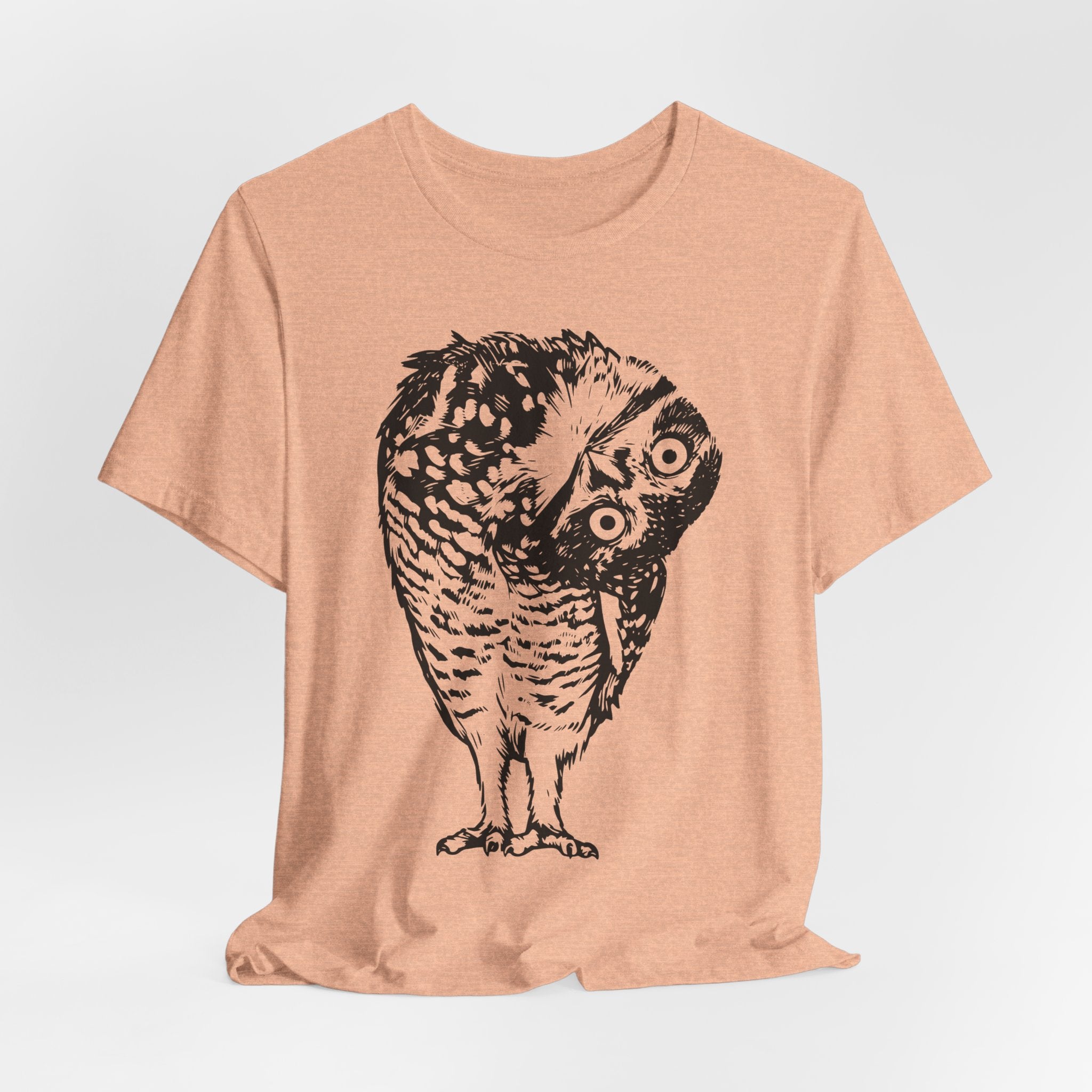 Person wearing white shocked owl graphic tee outdoors, funny bird nature shirt
