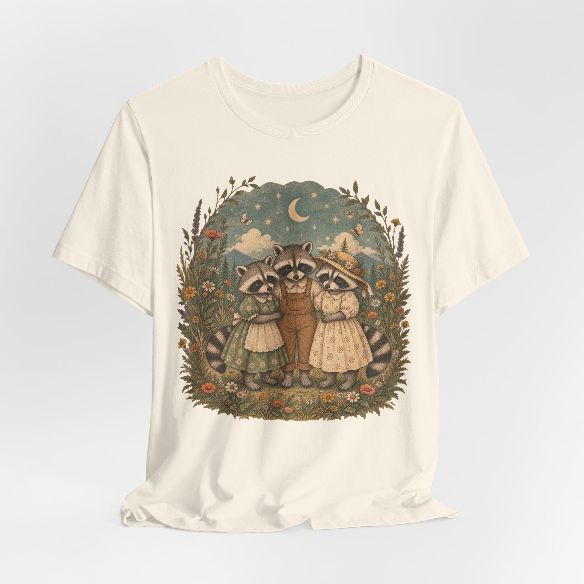 Cottagecore Raccoon Family Tee in Heather Peach worn shot - sweet raccoon family wildflower cottagecore shirt, Barely Outdoorsy Bella Canvas