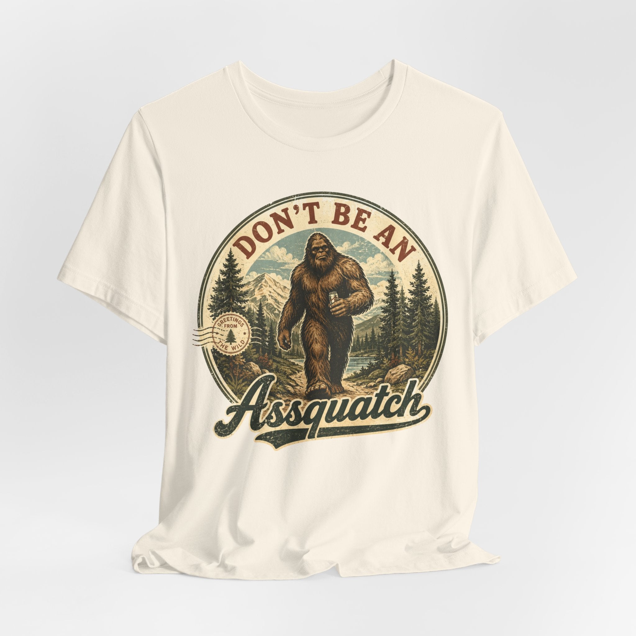 Don't Be An Assquatch Funny Bigfoot T-Shirt in Black worn shot - funny Sasquatch pun humor tee, Barely Outdoorsy Bella Canvas