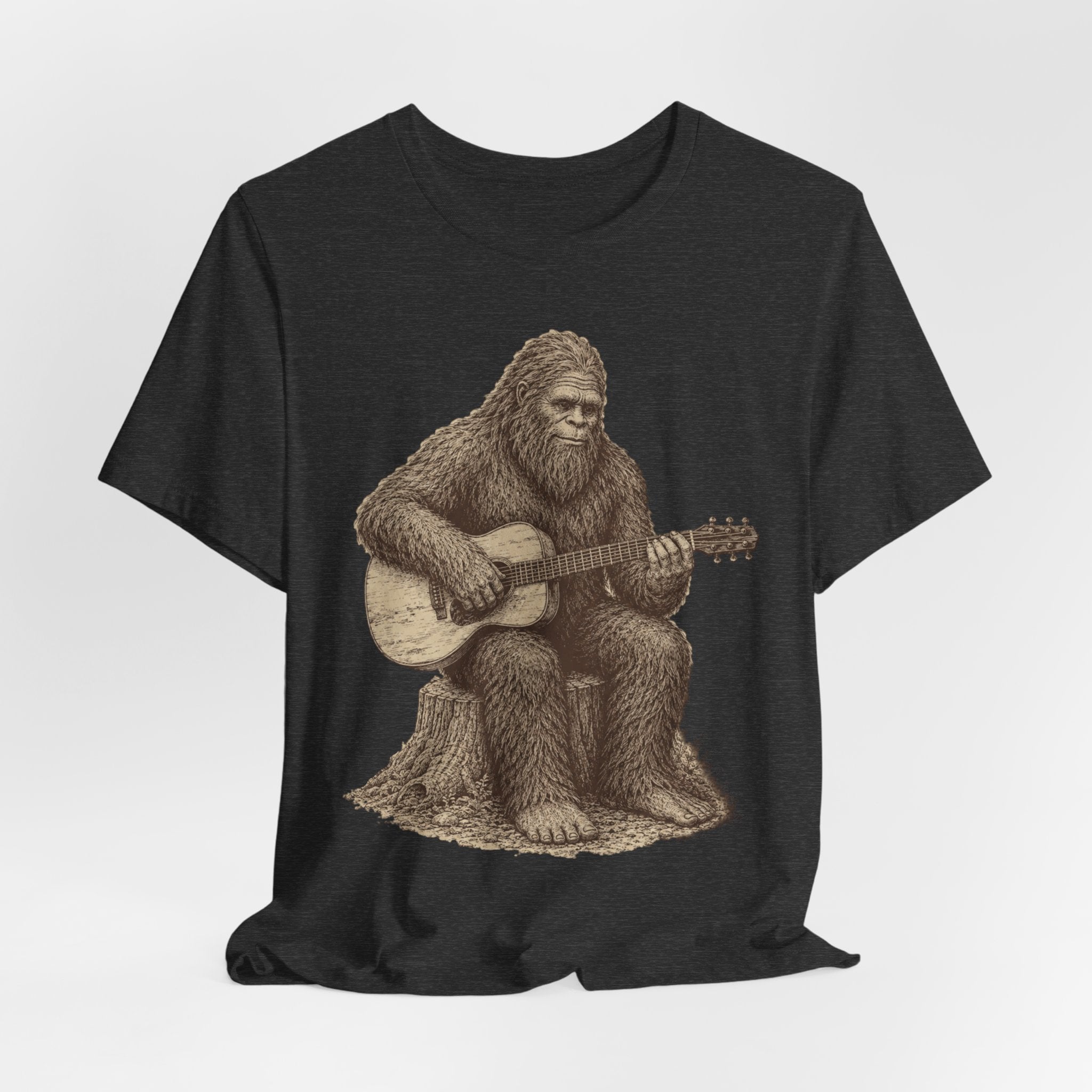 Bigfoot Guitar Tee flat lay Dark Grey Heather - unisex crew neck vintage Bigfoot guitar graphic tee, Barely Outdoorsy