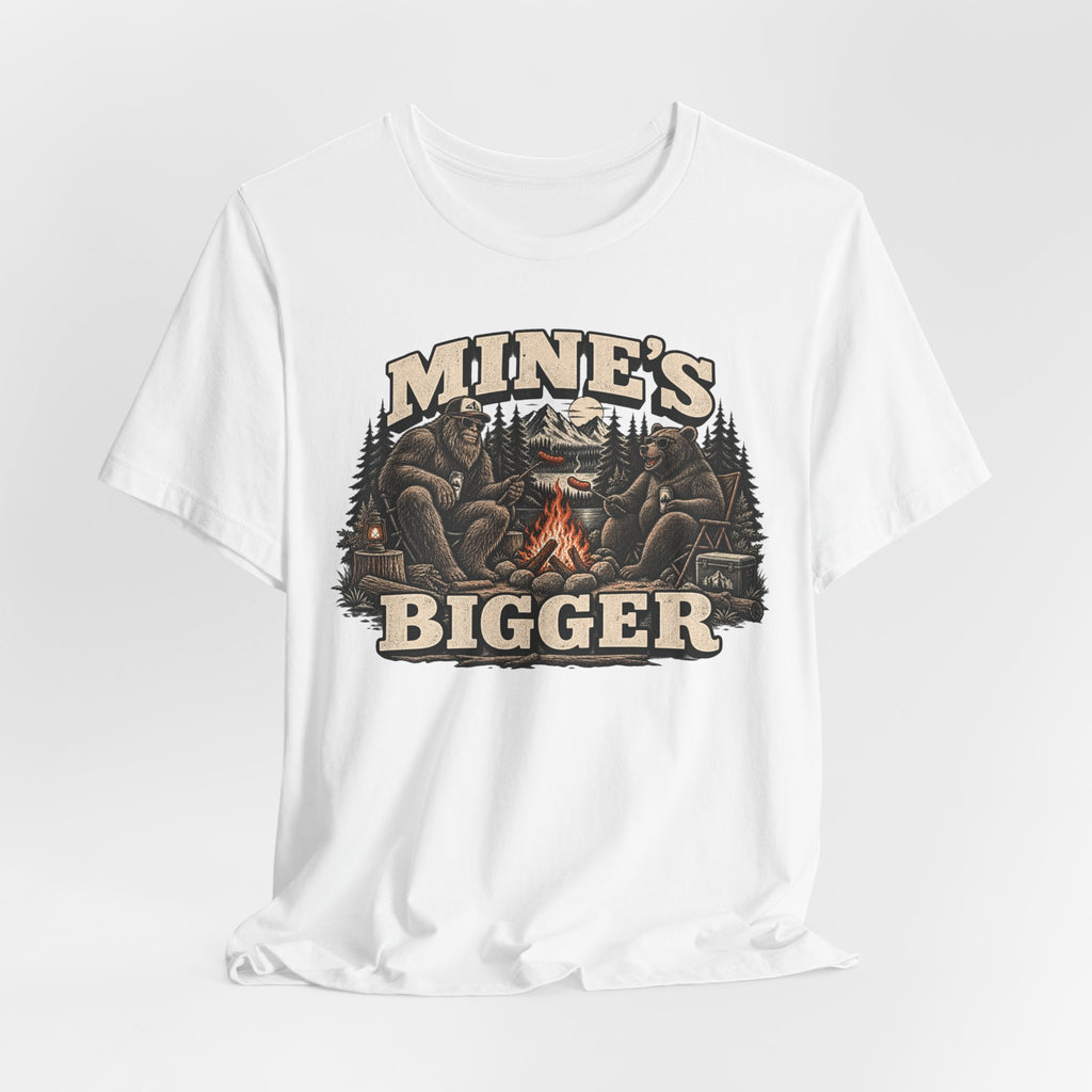 Mine's Bigger Funny Bigfoot T-Shirt in Black worn shot - funny Bigfoot campfire shadow humor tee, Barely Outdoorsy Bella Canvas