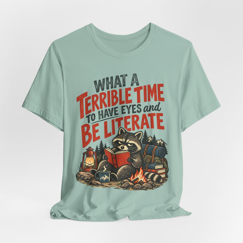 Terrible Time to Be Literate Camping Raccoon T-Shirt flat lay Sand Dune - unisex raccoon camping literate shirt, Barely Outdoorsy
