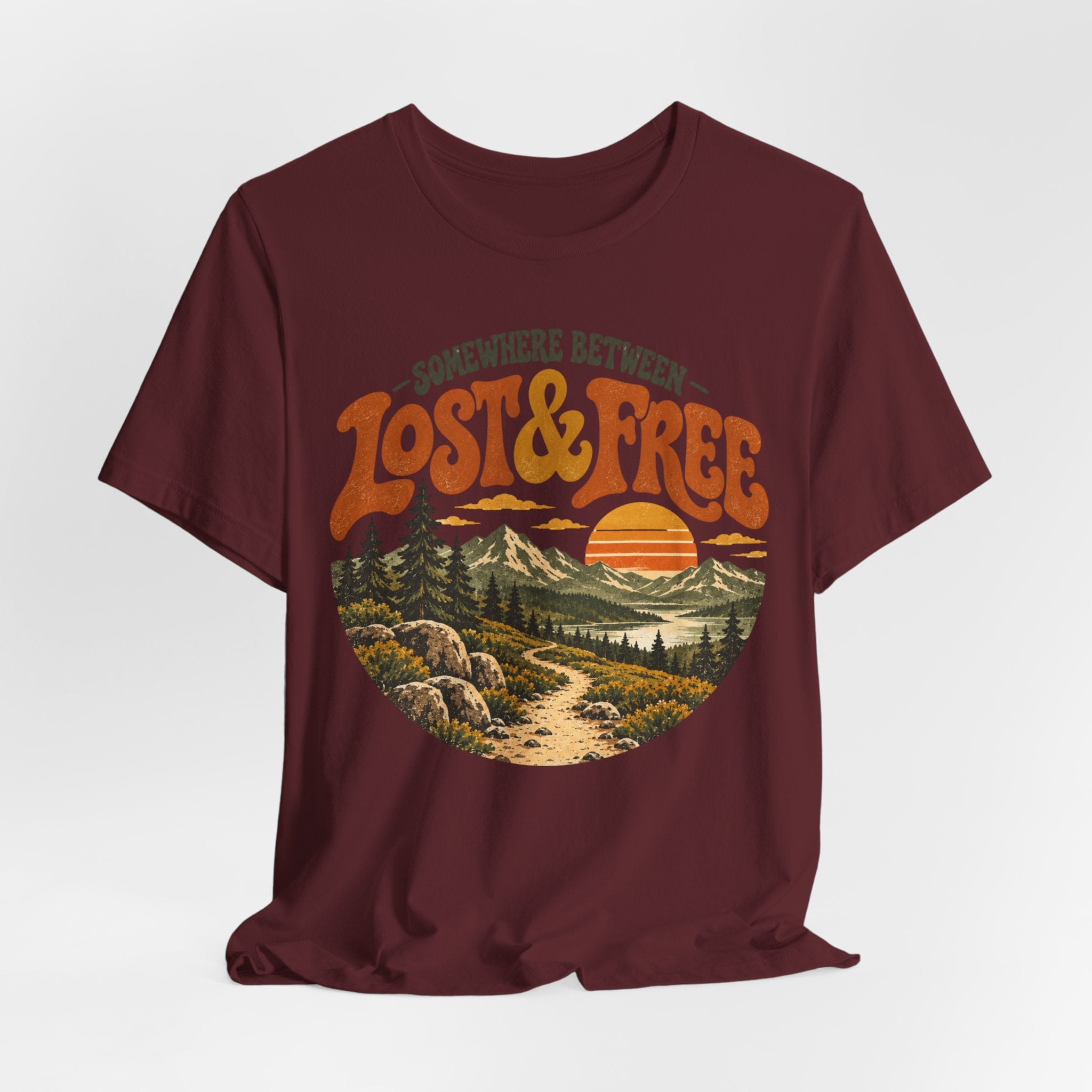 Somewhere Between Lost Free Tee in Dark Grey Heather detail - retro hiking adventure close-up graphic