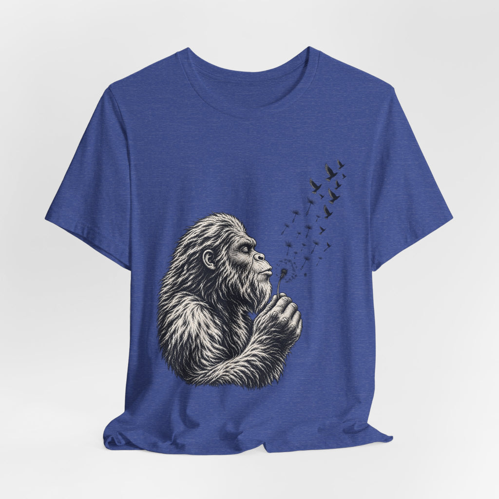 Bigfoot Blowing Dandelion Wishes T-Shirt flat lay Athletic Heather - unisex crew neck Bigfoot dandelion graphic tee, Barely Outdoorsy