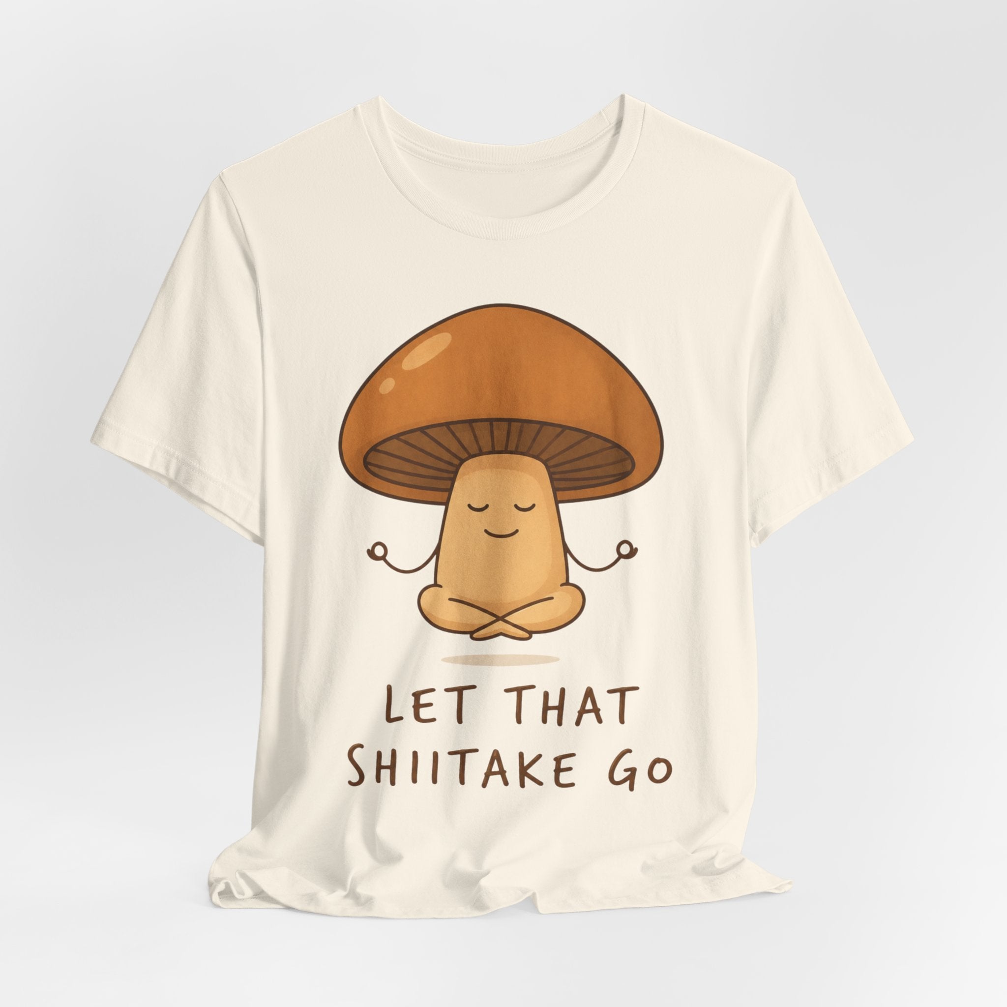 Let That Shiitake Go Tee in Black flat lay - funny fungi pun unisex crew neck shirt, Barely Outdoorsy