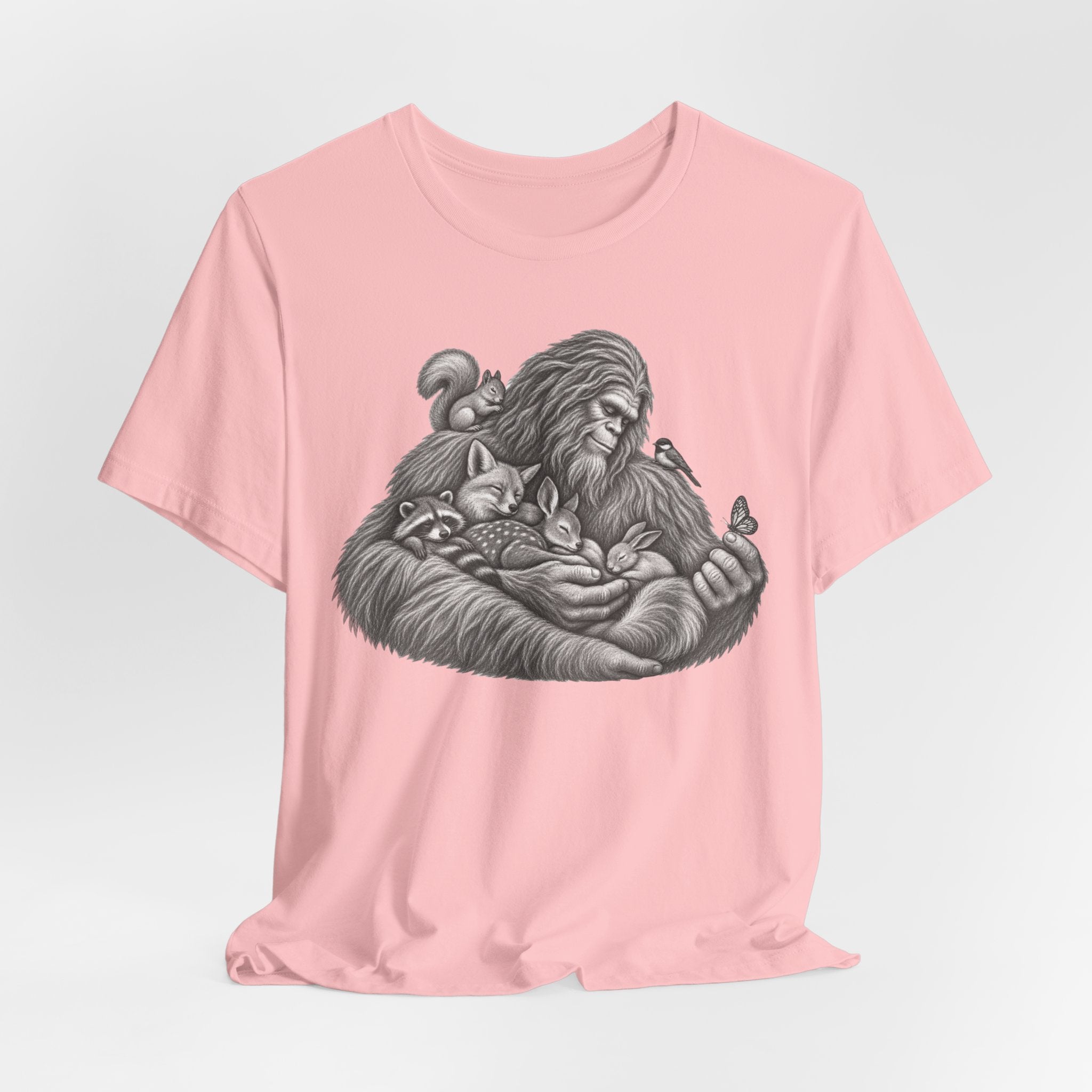 Guardian of the Forest Bigfoot Tee in Heather Peach worn shot - painterly Bigfoot forest shirt, Barely Outdoorsy Bella Canvas