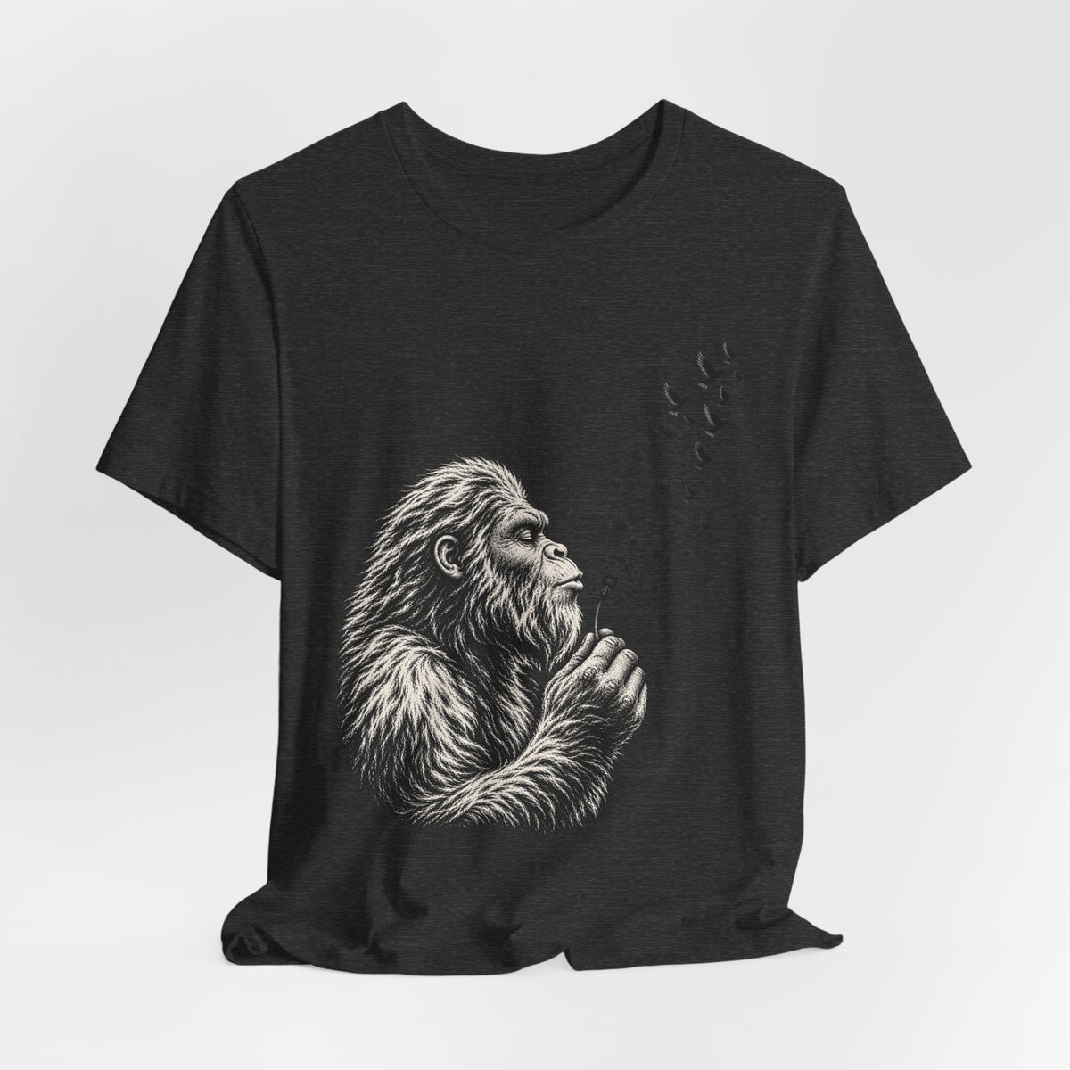 Bigfoot Blowing Dandelion Wishes Tee in Dark Grey Heather detail - Sasquatch dandelion wish close-up graphic
