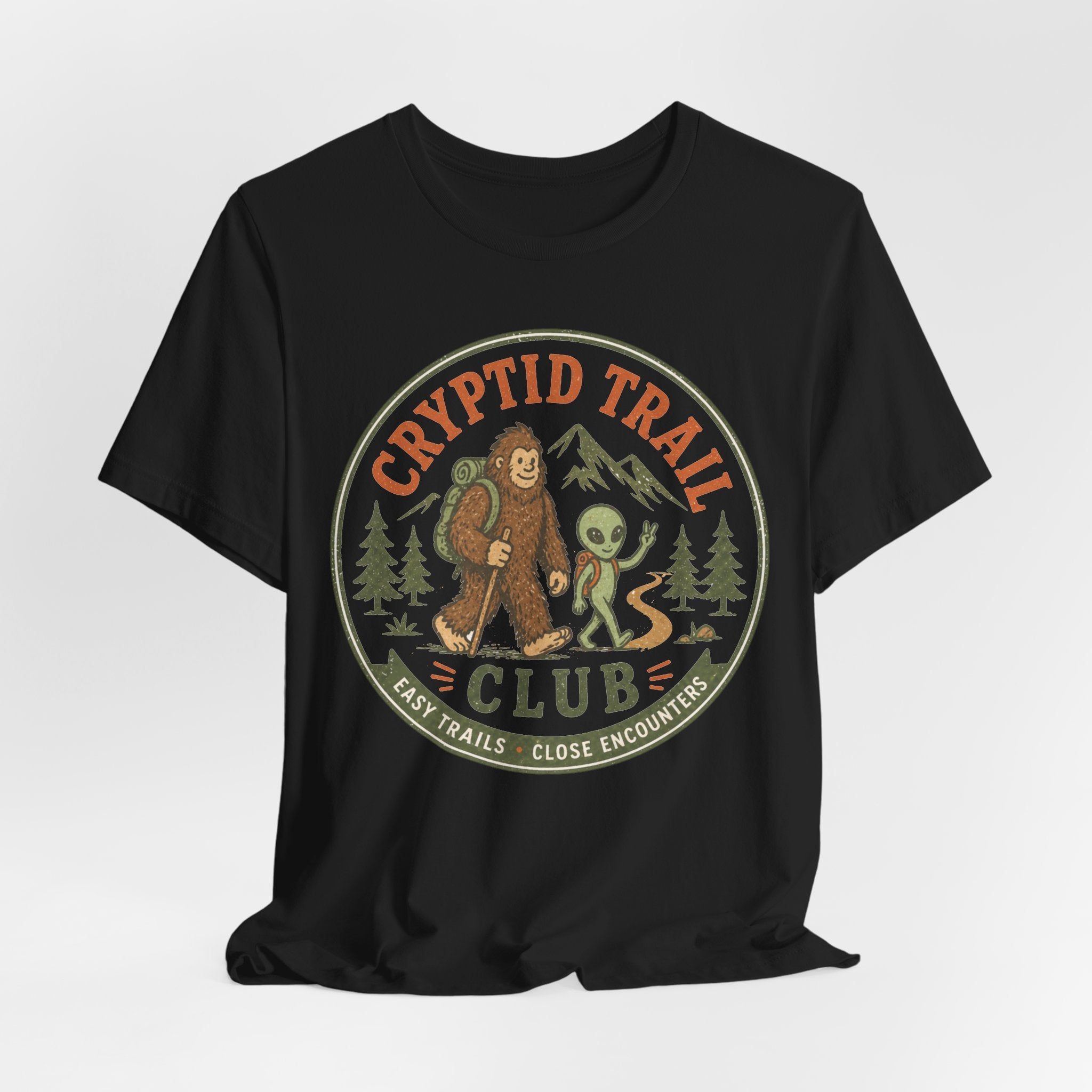 Person wearing cryptid trail club shirt funny outdoor hiking apparel