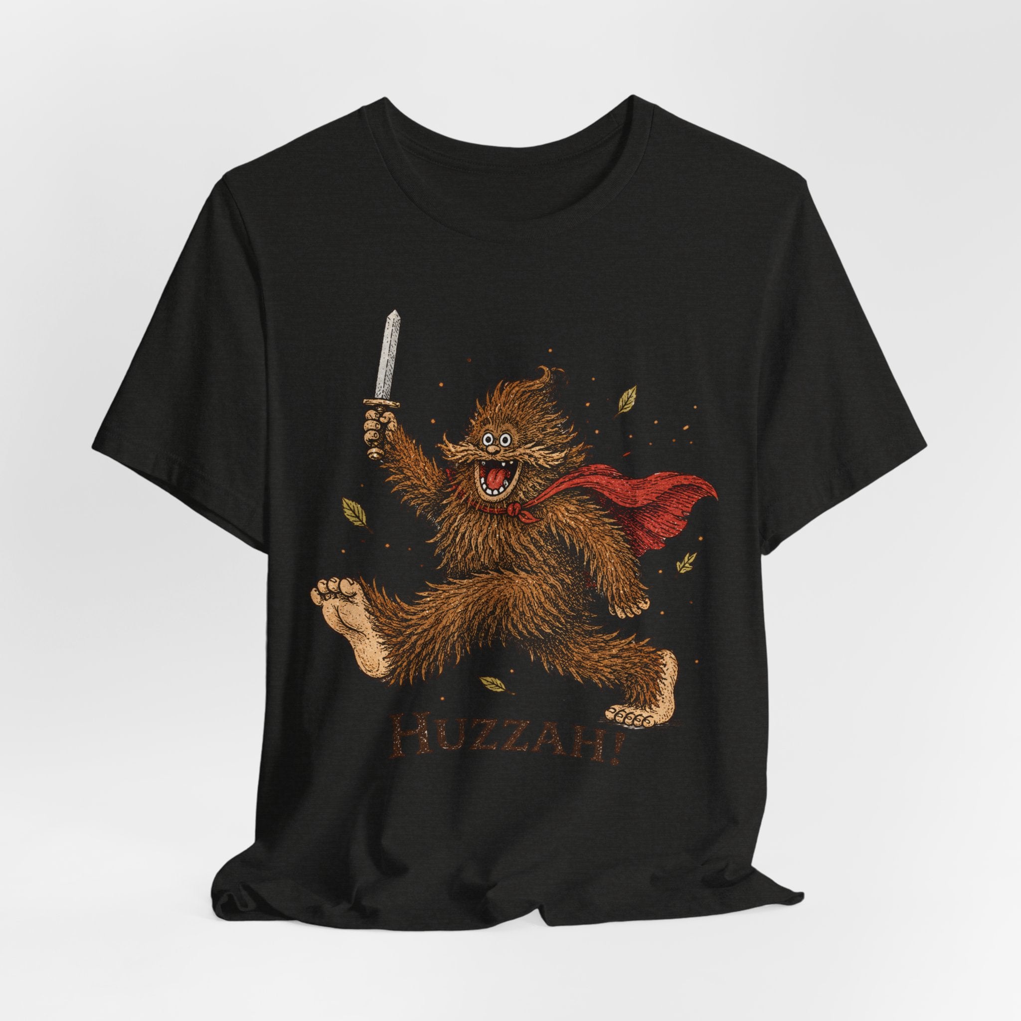 Huzzah Bigfoot T-Shirt flat lay Navy - unisex crew neck Bigfoot fantasy graphic tee, Barely Outdoorsy