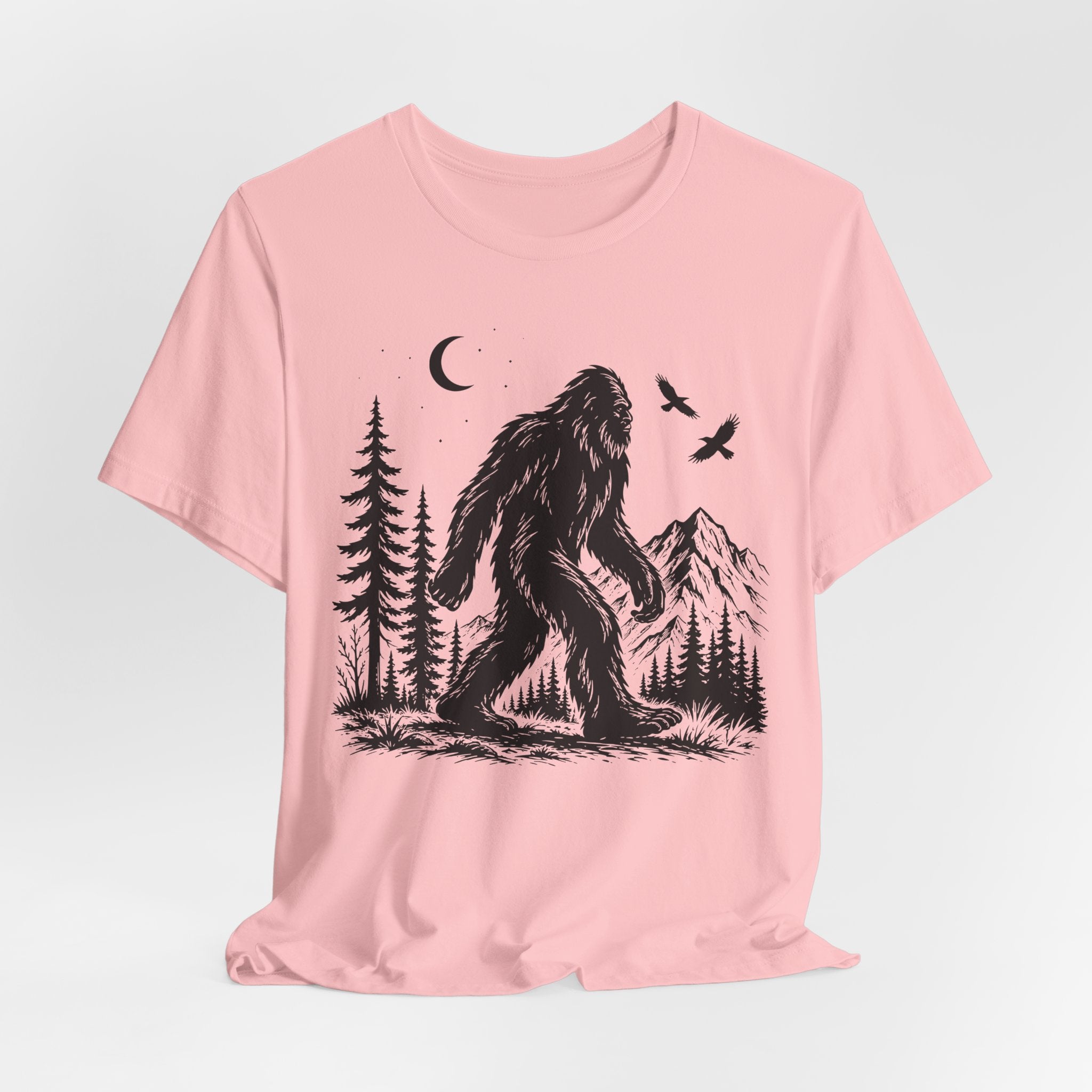 Bigfoot Night Forest Mountain T-Shirt flat lay Athletic Heather - unisex crew neck moonlit Bigfoot graphic tee, Barely Outdoorsy
