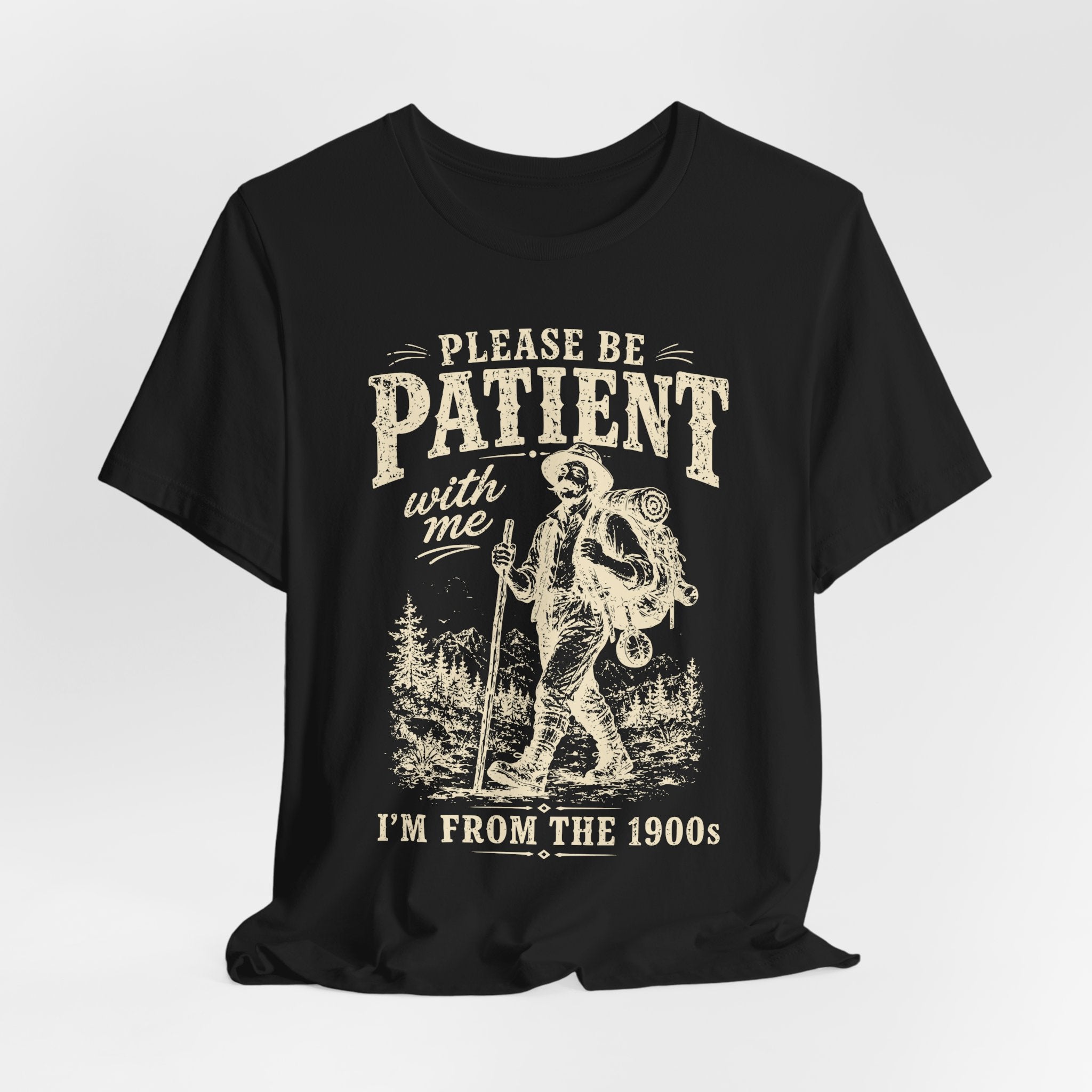 Please Be Patient I'm From The 1900s Tee in Black worn shot - vintage hiker Gen X humor shirt, Barely Outdoorsy