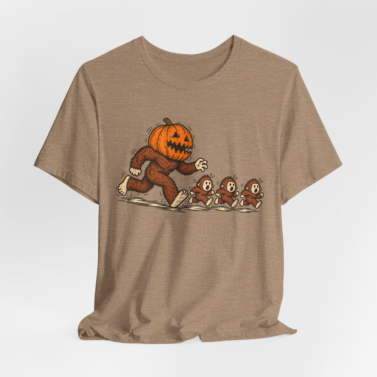 Pumpkin Head Bigfoot Halloween Tee flat lay Heather Green - unisex crew neck Bigfoot Halloween graphic tee, Barely Outdoorsy