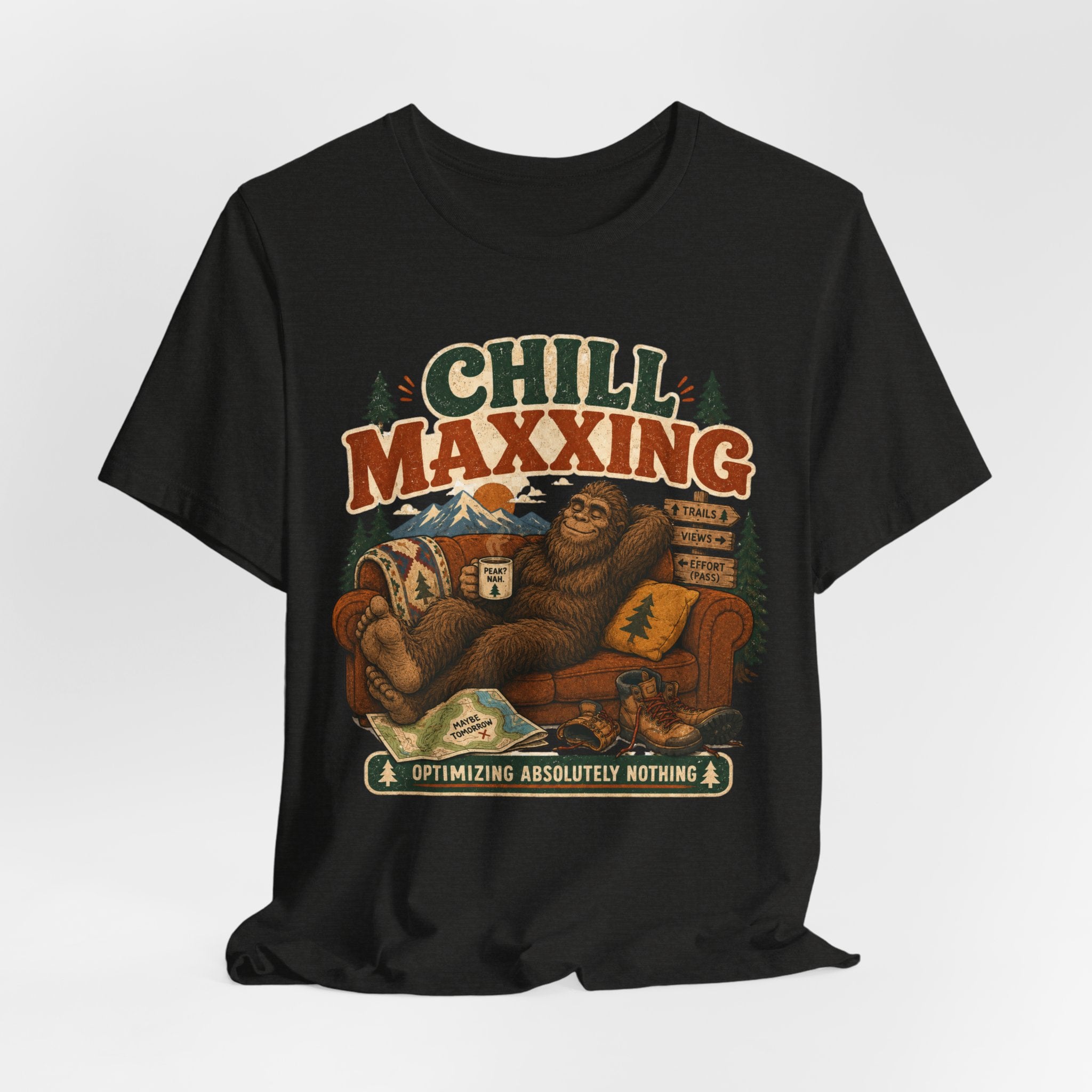 Barely Outdoorsy Chill Maxxing Bigfoot T-Shirt - Bigfoot relaxing on couch in mountains, Bella Canvas 3001 unisex tee