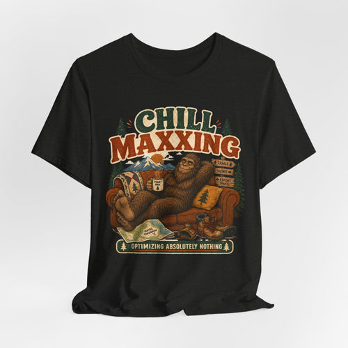 Barely Outdoorsy Chill Maxxing Bigfoot T-Shirt - Bigfoot relaxing on couch in mountains, Bella Canvas 3001 unisex tee