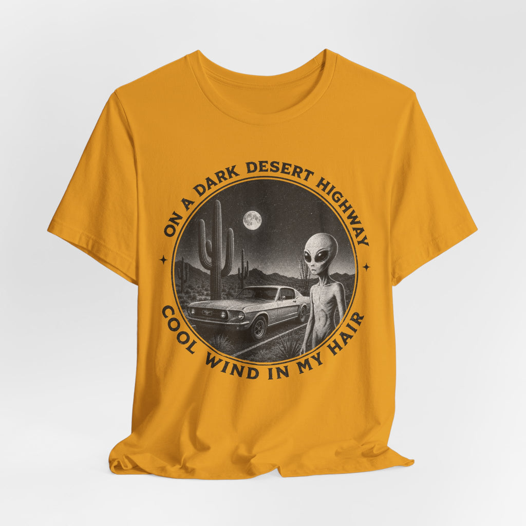Person wearing black alien desert highway graphic tee, vintage UFO road trip shirt